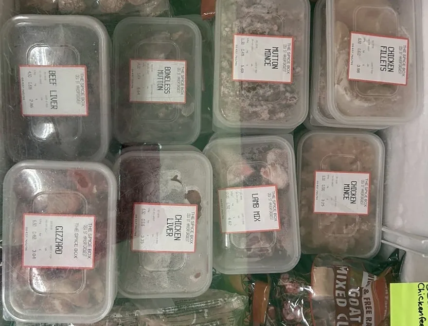 Freezer tubs labelled in the shop: boneless mutton, mutton mince, chicken fillets, lamb mix and chicken mince